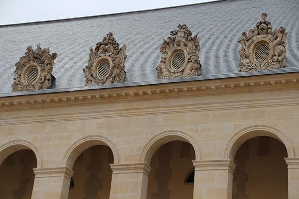 a stone building with arches and ornate windows