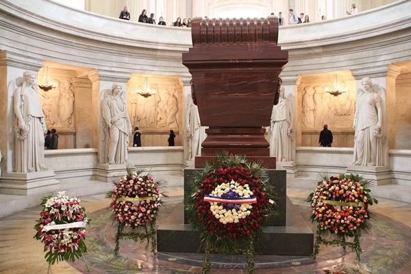 closeup of Napoleon\'s tomb with flowers in front of it