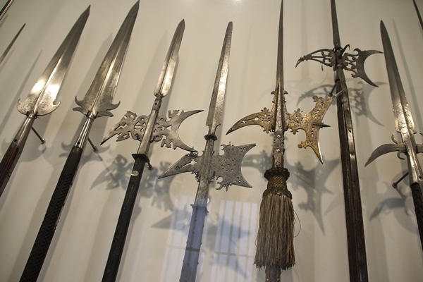 ornate spears in a museum display