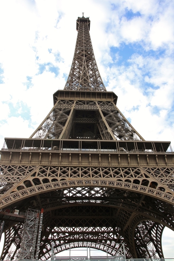 a view looking up at the Eiffel Tower from right below