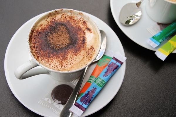 overhead view of a cappuccino topped with cocoa powder