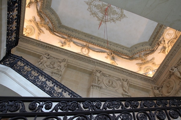 an ornate staircase in a historic building