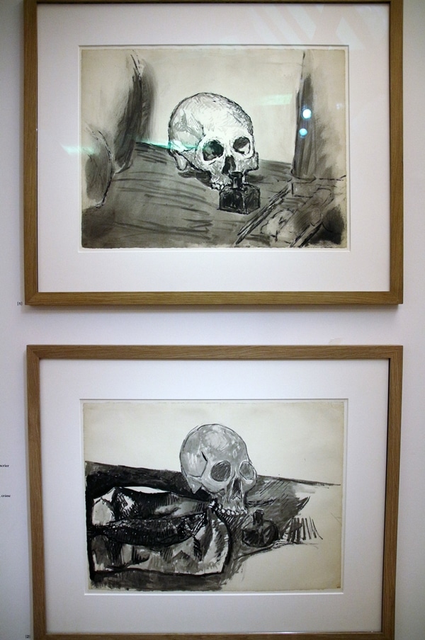 paintings of skulls in a museum