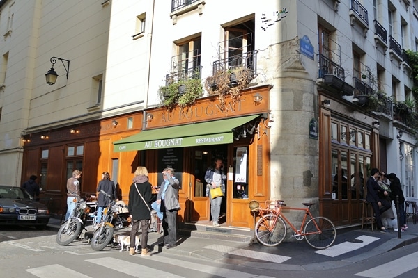 exterior of a small bistro with green awning