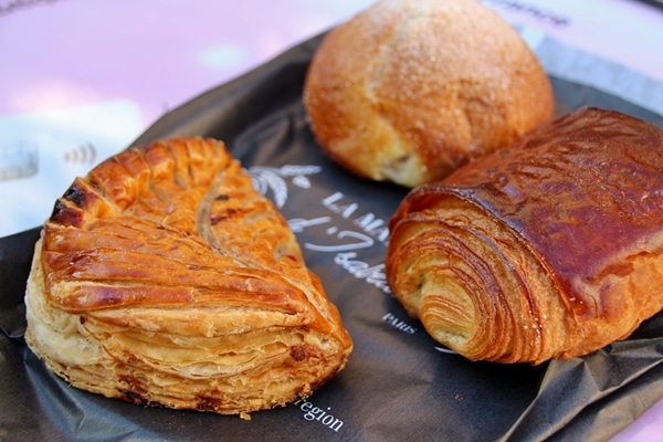 3 French pastries on a paper bag