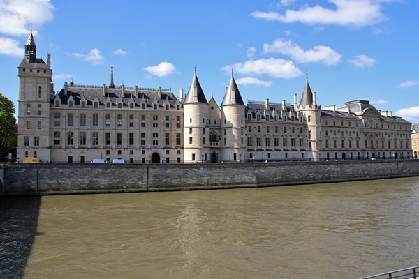 a palatial building on the shore of a river