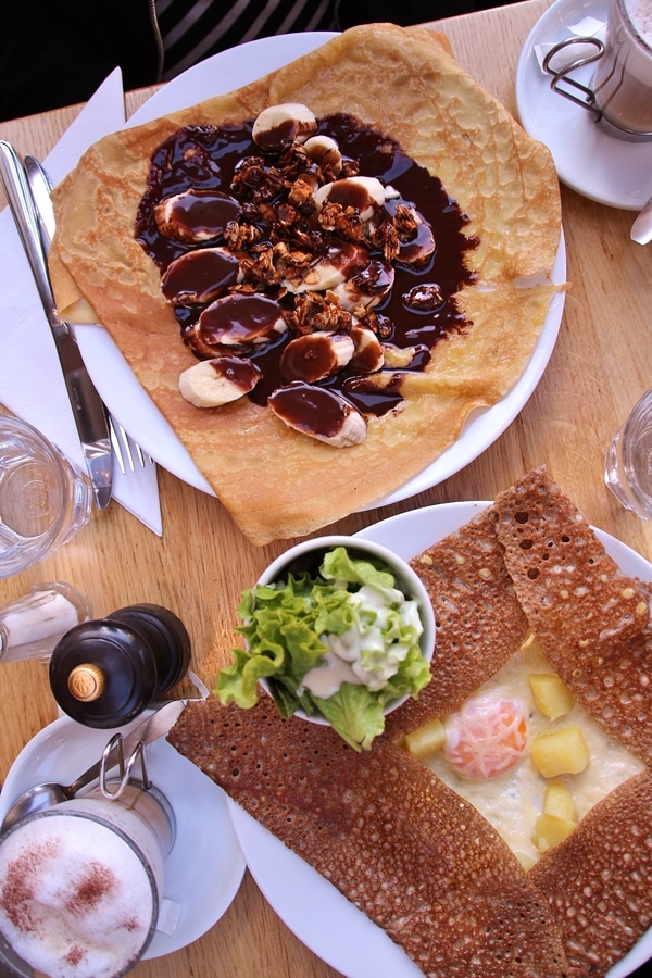 overhead view of 2 crepes on a wooden table