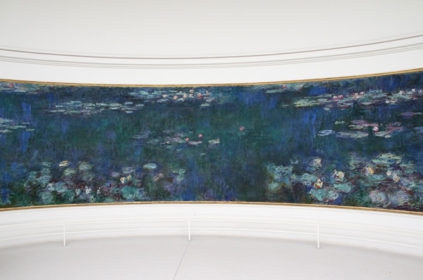 a very large rectangular painting of waterlilies