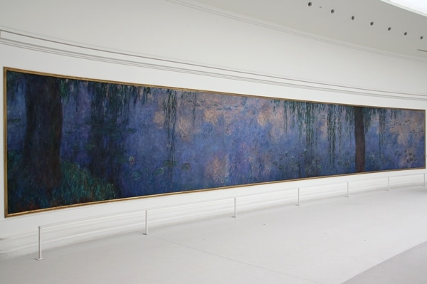 a very large rectangular painting on a white wall