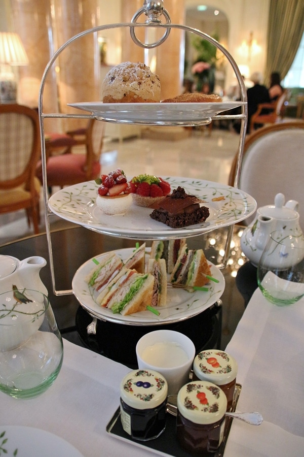 a 3-tiered presentation of Afternoon Tea with different foods on each level