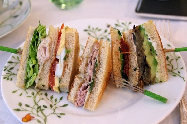 a variety of elegant tea sandwiches on a plate