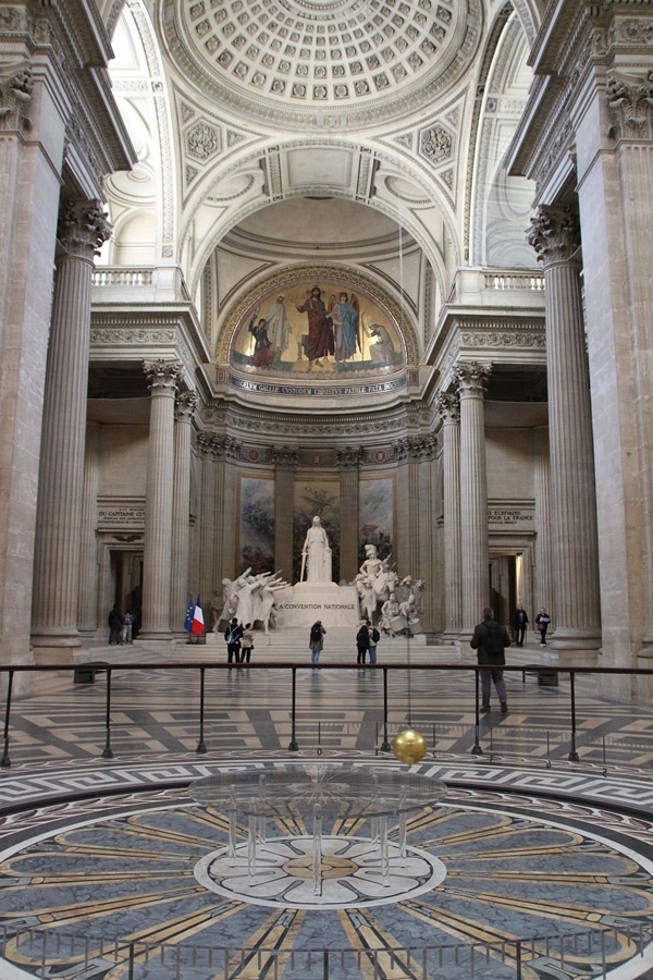 a pendulum inside a grand church