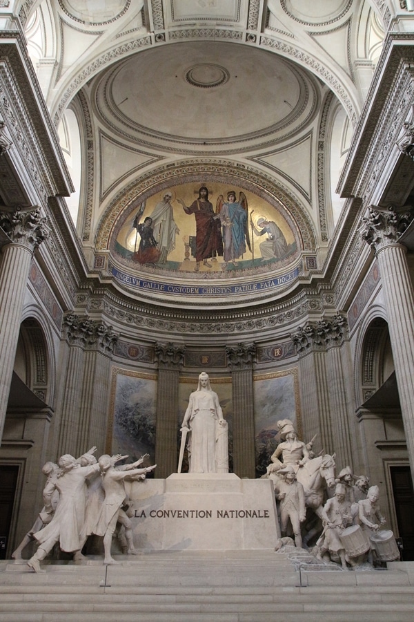 statues and paintings inside a large church