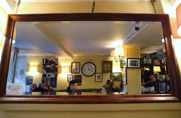 reflection of restaurant interior in a large mirror