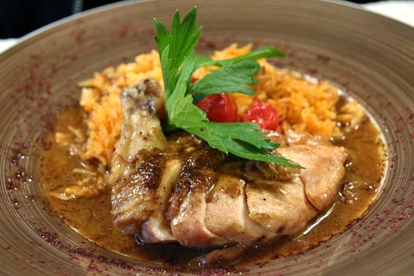 sliced chicken breast with rice on a brown plate