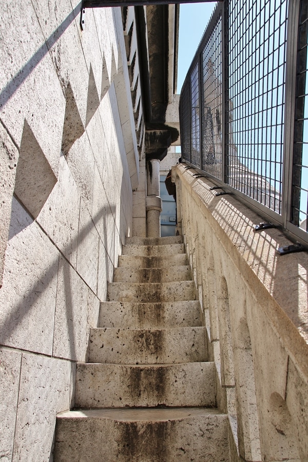 narrow exterior walkway with steps