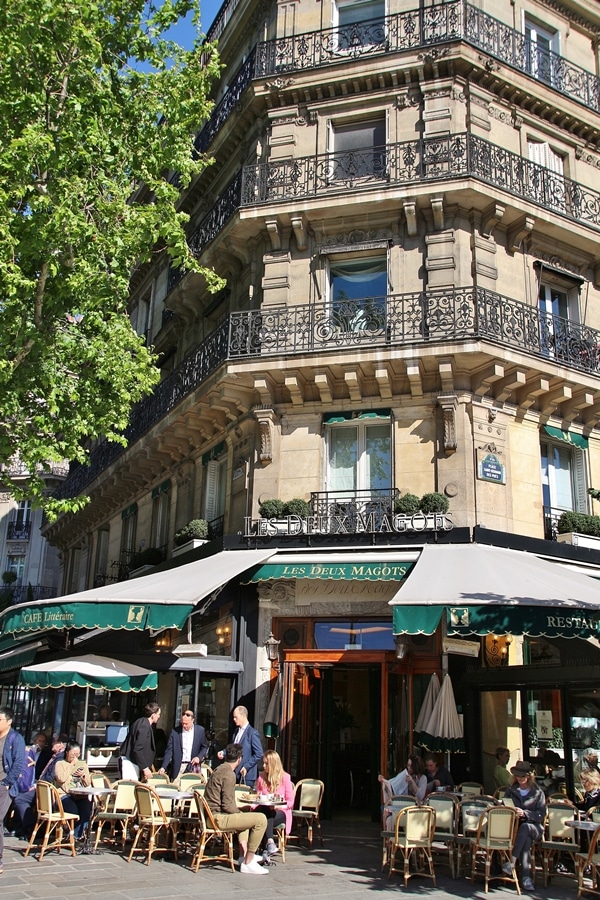 exterior of a Parisian bistro with green awning