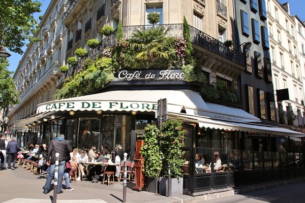 exterior of a Parisian cafe with white awning