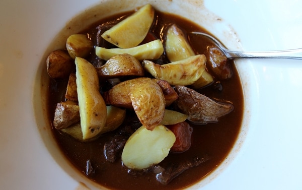 a bowl of Burgundy beef stew with potatoes