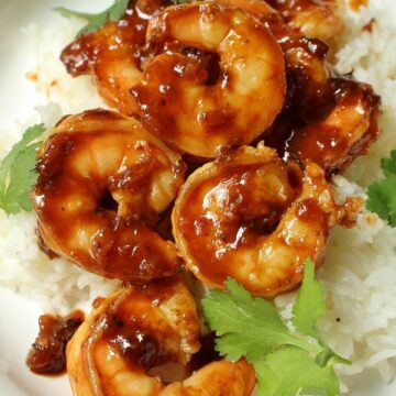 sticky shrimp in pomegranate sriracha sauce served with rice