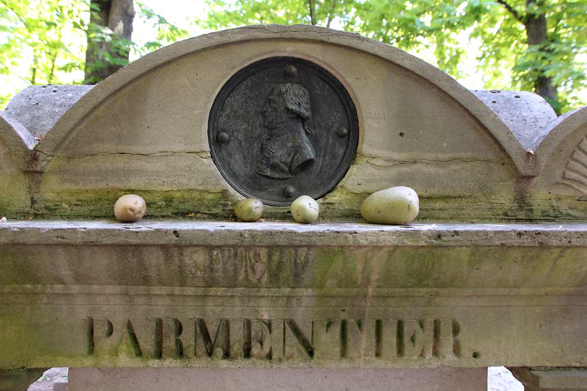 Closeup of potatoes on top of Parmentier's grave in Paris.