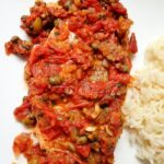 Veracruz style fish with tomato, caper, and olive sauce with side of rice