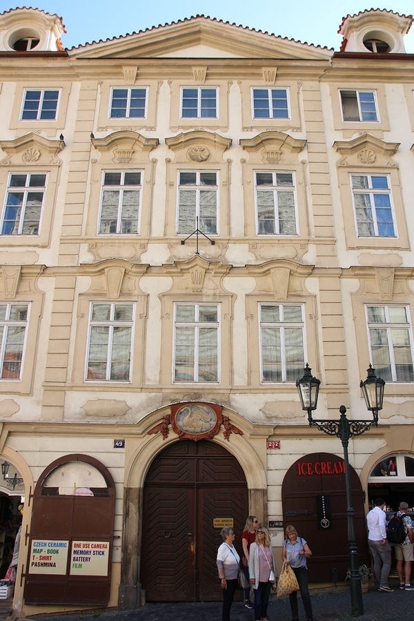 a large building with an emblem of a swan over the doorway