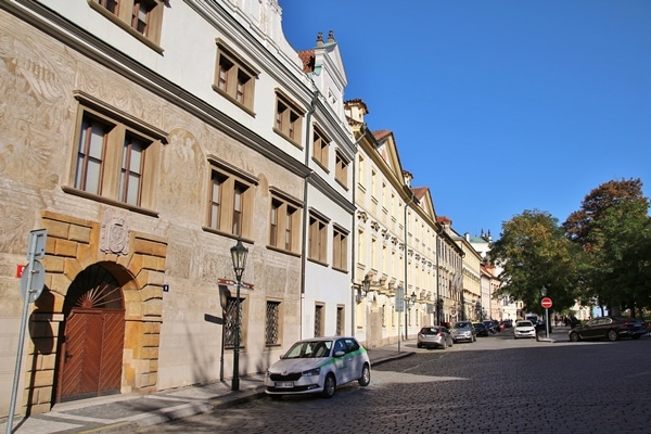 a peaceful city street lined with houses