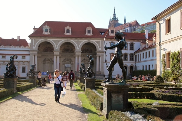 a row of statues in front of a building