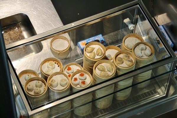 stacks of bamboo steamer baskets filled with dumplings