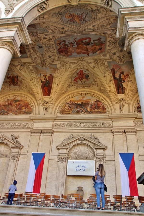 a huge open-air entryway with fresco ceilings