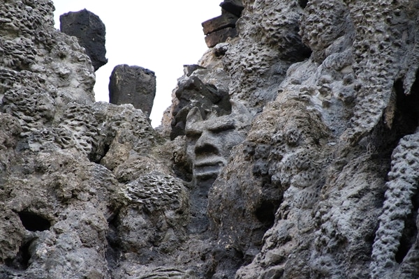 a stone grotto with a hidden face