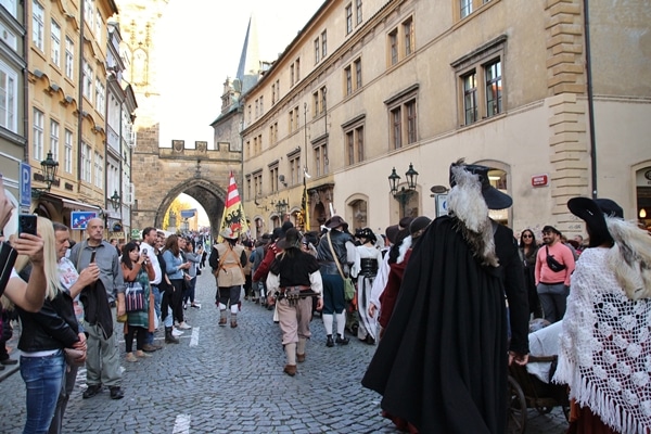 A group of people walking on a city street