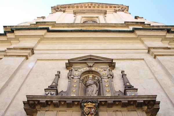 looking up at a large stone church