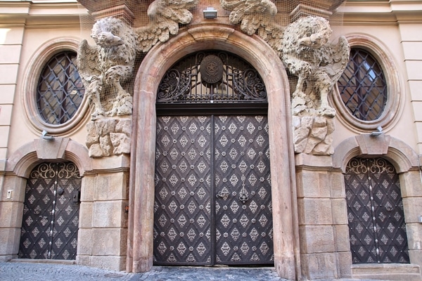 an ornate door on a stone building