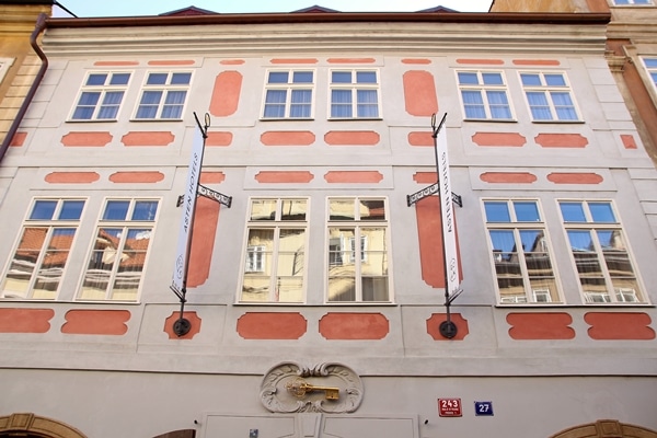 A large gold key decorating the front of a tall building