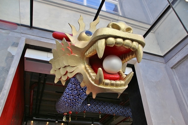 a dragon\'s head with a pearl in its mouth