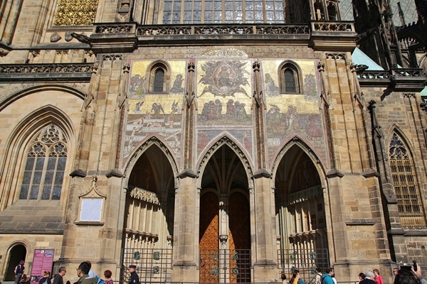 A group of people standing in front of a church