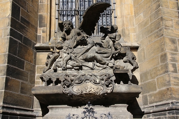 A stone sculpture in front of a building