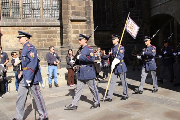 soldiers in blue uniforms marching in a line