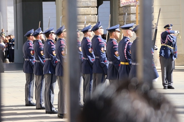 closeup of a row of soldiers in blue uniforms