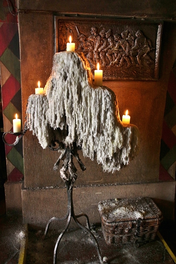 a large candelabra with lots of melted wax dripping from it