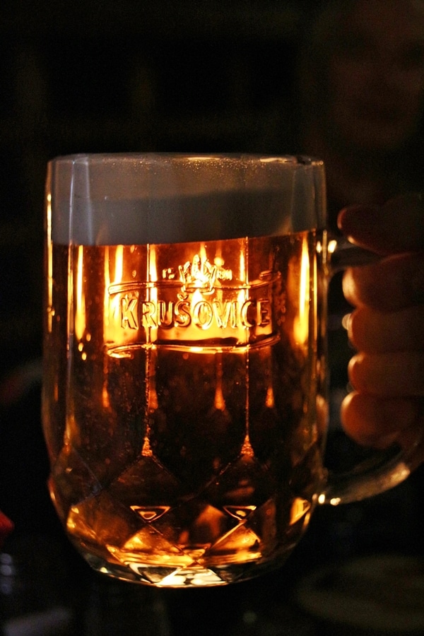 light shining through a glass of beer