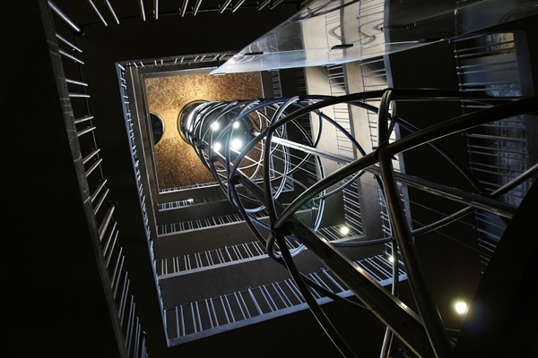 view looking up an elaborate glass elevator shaft