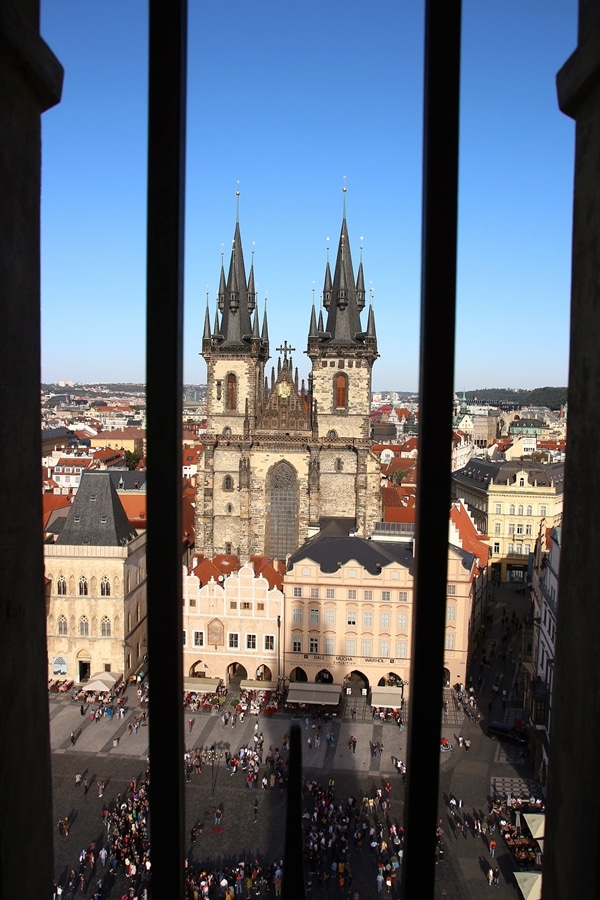 a large church viewed through a barred window