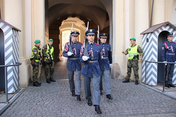 3 soldiers marching through a tunnel