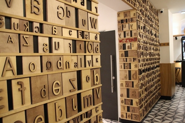 interior of a restaurant with letter blocks decorating the walls