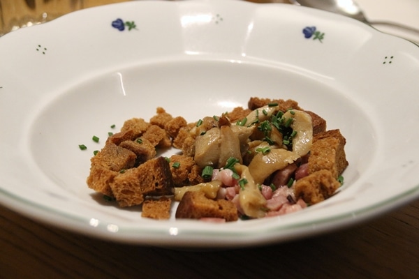 rye croutons, mushrooms, and ham in a wide bowl