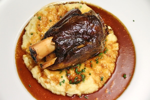 roasted pork knuckle over a soft puree with brown sauce
