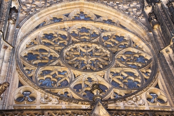 close up of a large round picture window on a church